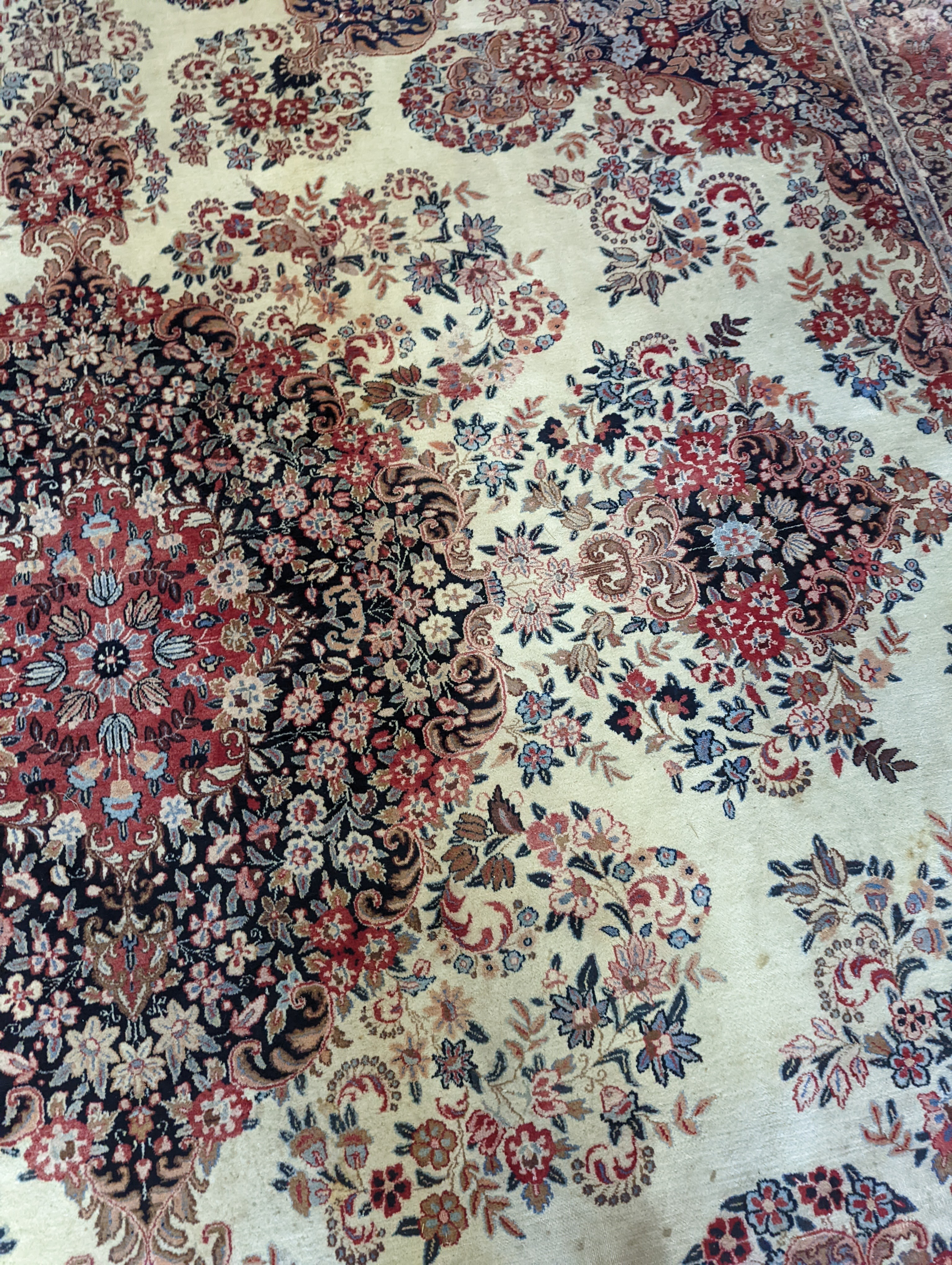 A North West Persian ivory ground carpet, 410 x 310cm